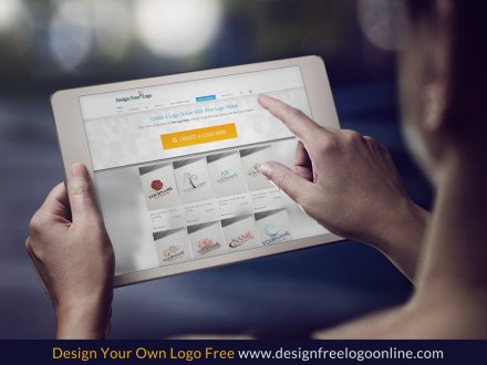 A woman is using an ipad to design her own logo.